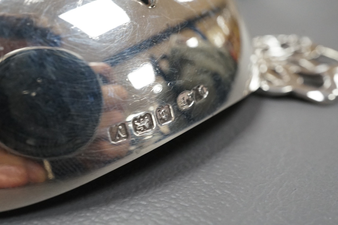 An Edwardian Art Nouveau planished silver tri-handled bowl by Charles Edwards, London, 1905, with stylised handles, diameter 94mm excluding handles, together with a pair of later silver two handled bonbon dishes, Deakin
